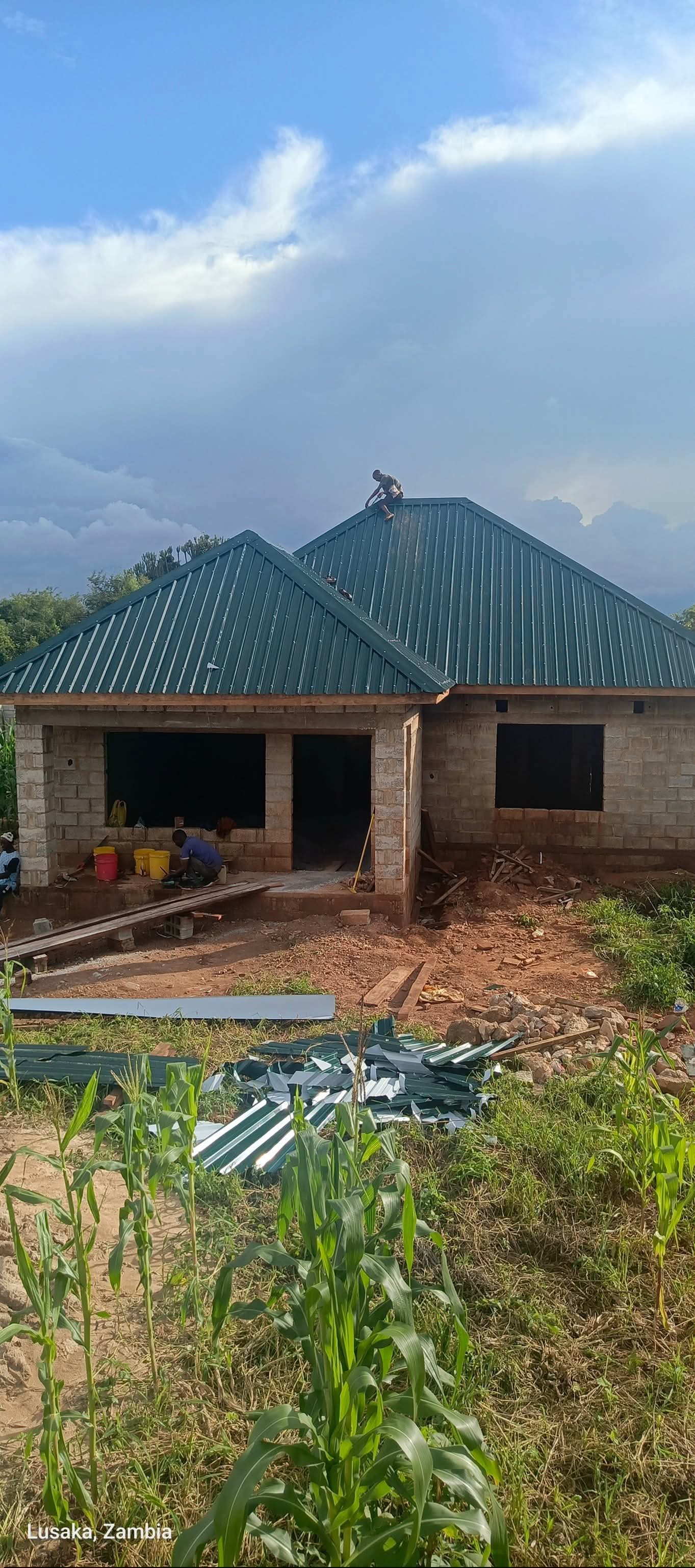 Crew installing longspan roofing in Lugbe, Abuja